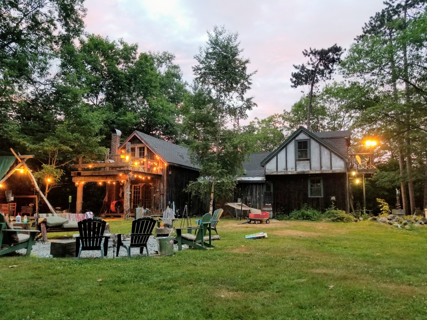 Adding outdoor seating to your home landscape design is essential.